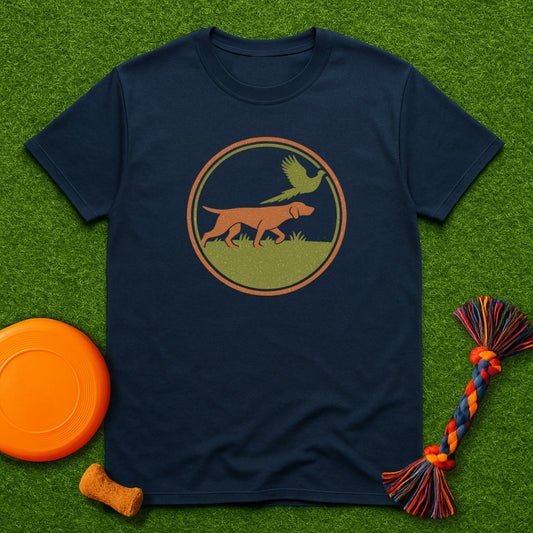 Navy blue t-shirt with a graphic of a dog and bird on grass, accompanied by a frisbee and dog toy.