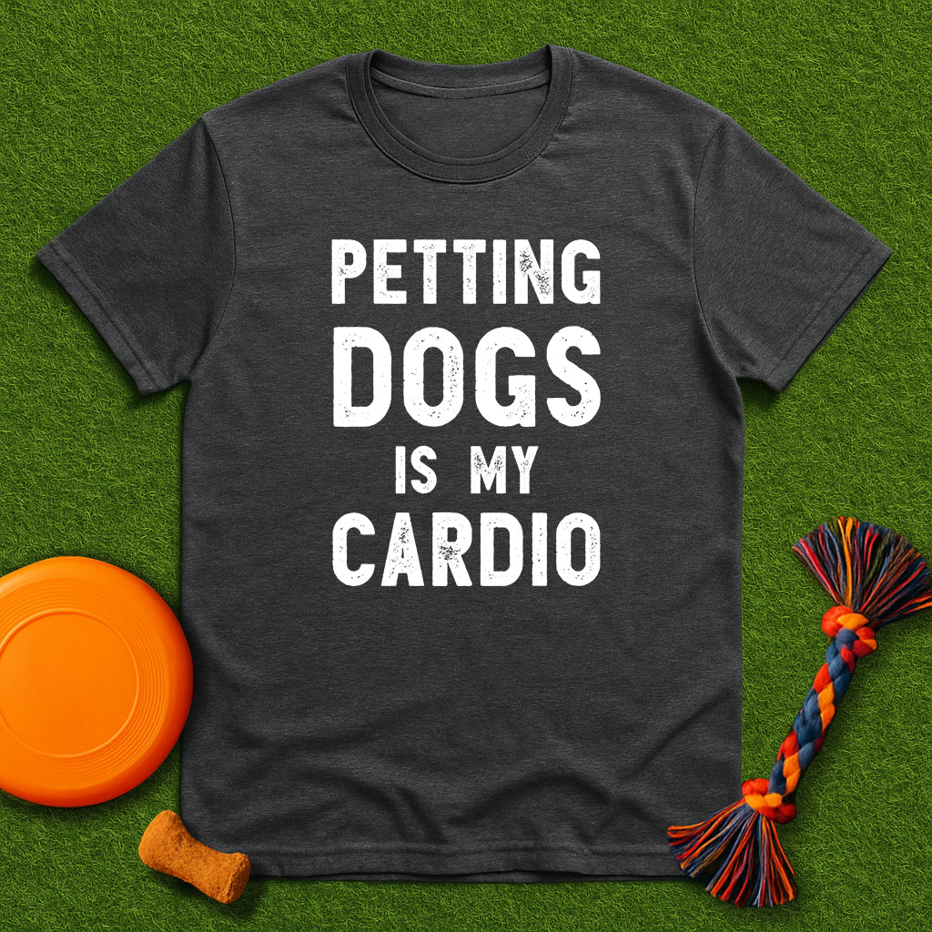 Dark gray t-shirt with 'Petting dogs is my cardio' text on a green grass background with dog toys.
